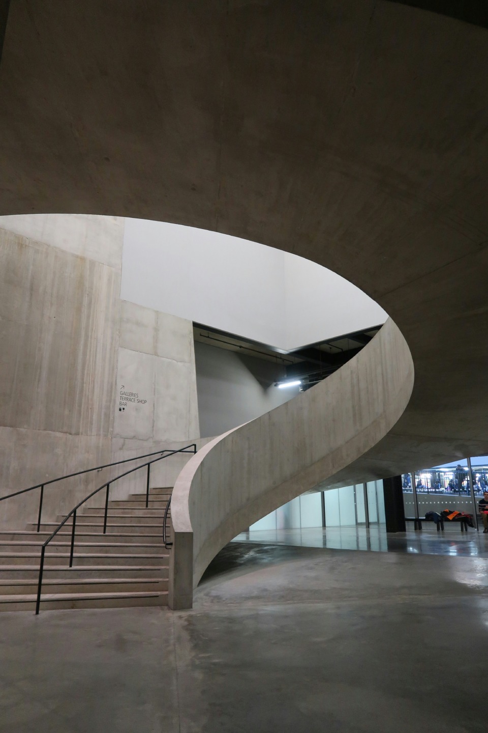 Concrete spiral staircase in modern building.